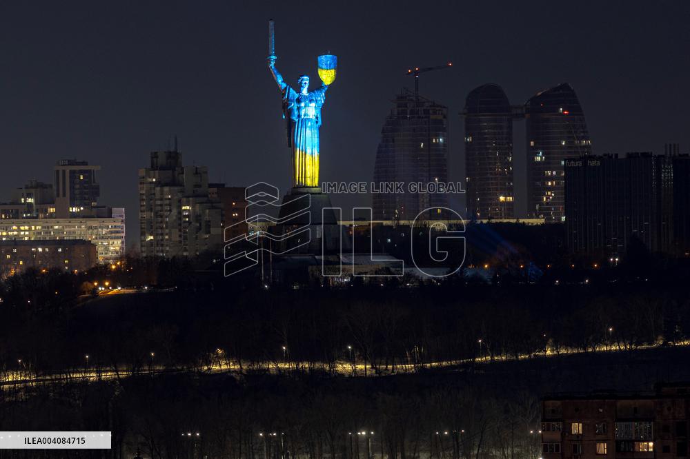 Motherland Monument shines in Ukraine's national colours