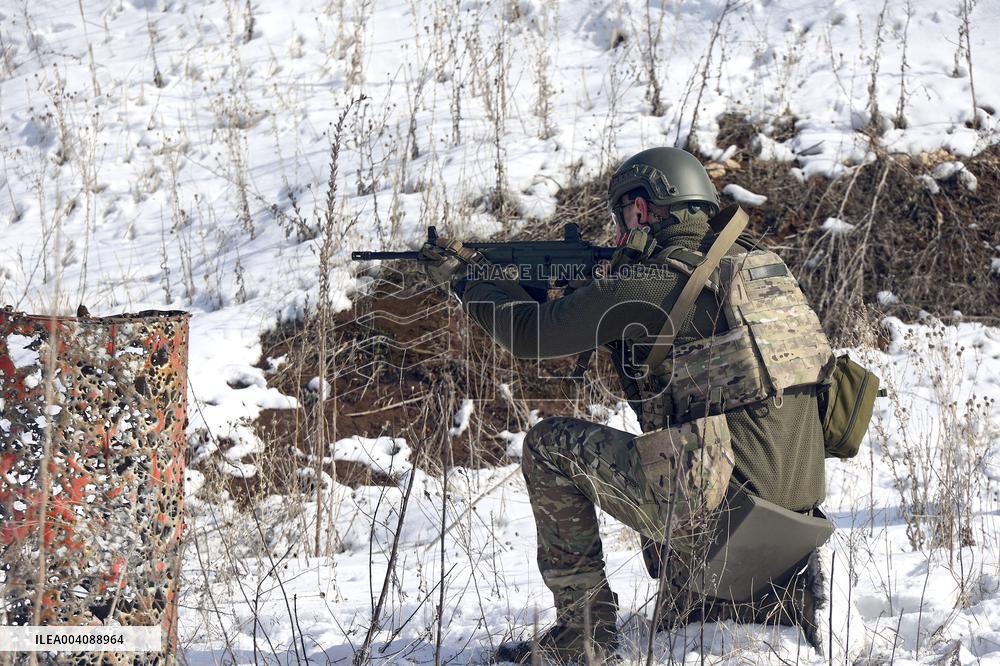 Ukraines Khartiia Brigade infantry personnel test out new weapons