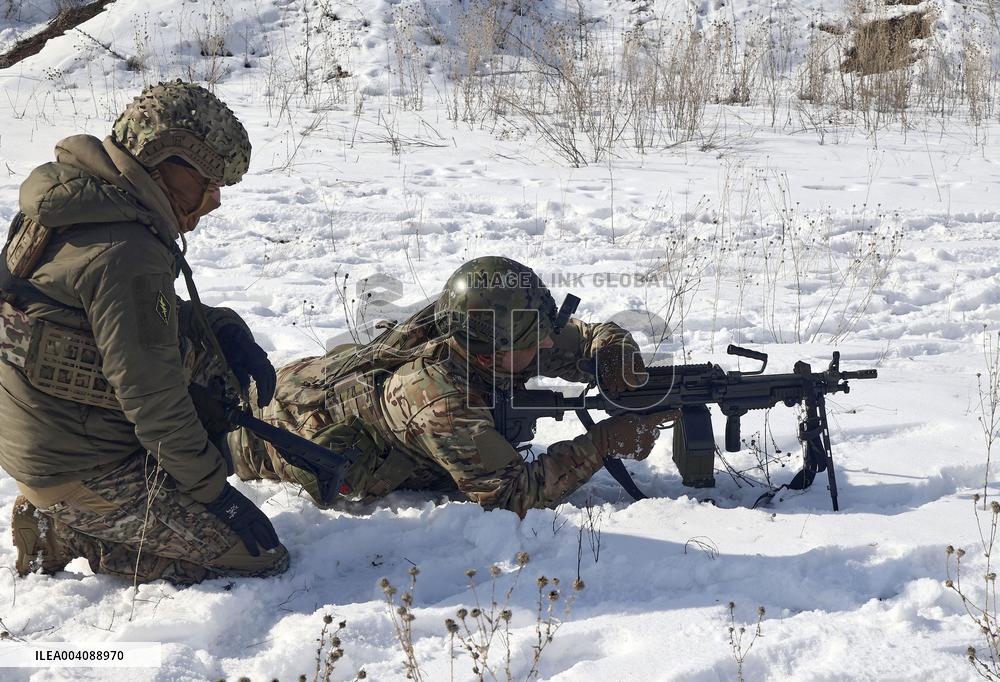 Ukraines Khartiia Brigade infantry personnel test out new weapons