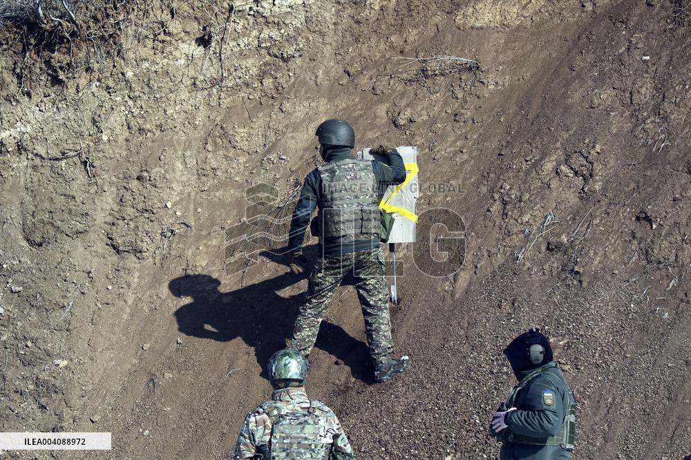 Ukraines Khartiia Brigade infantry personnel test out new weapons