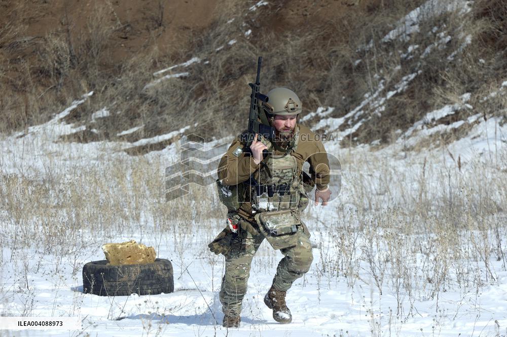 Ukraines Khartiia Brigade infantry personnel test out new weapons