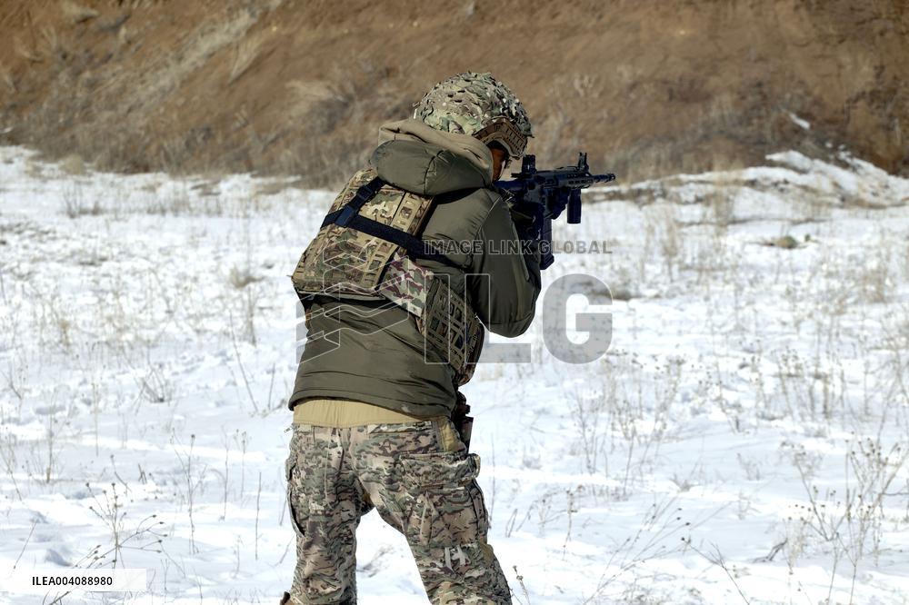 Ukraines Khartiia Brigade infantry personnel test out new weapons