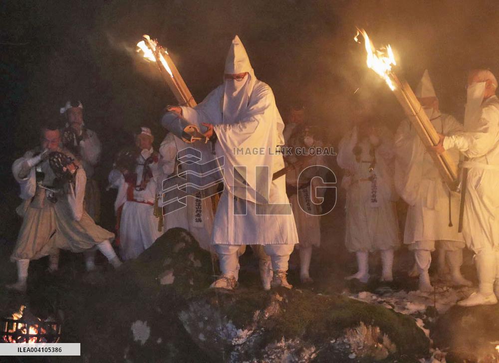 Ritual to pour holy water into river in Japan