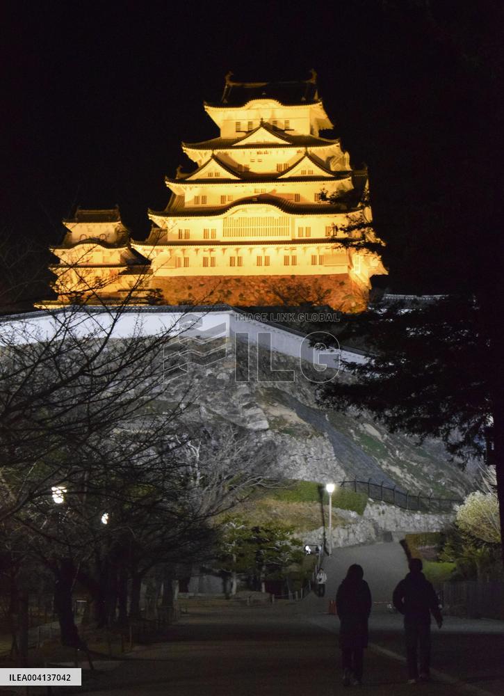 Himeji Castle lit up in yellow