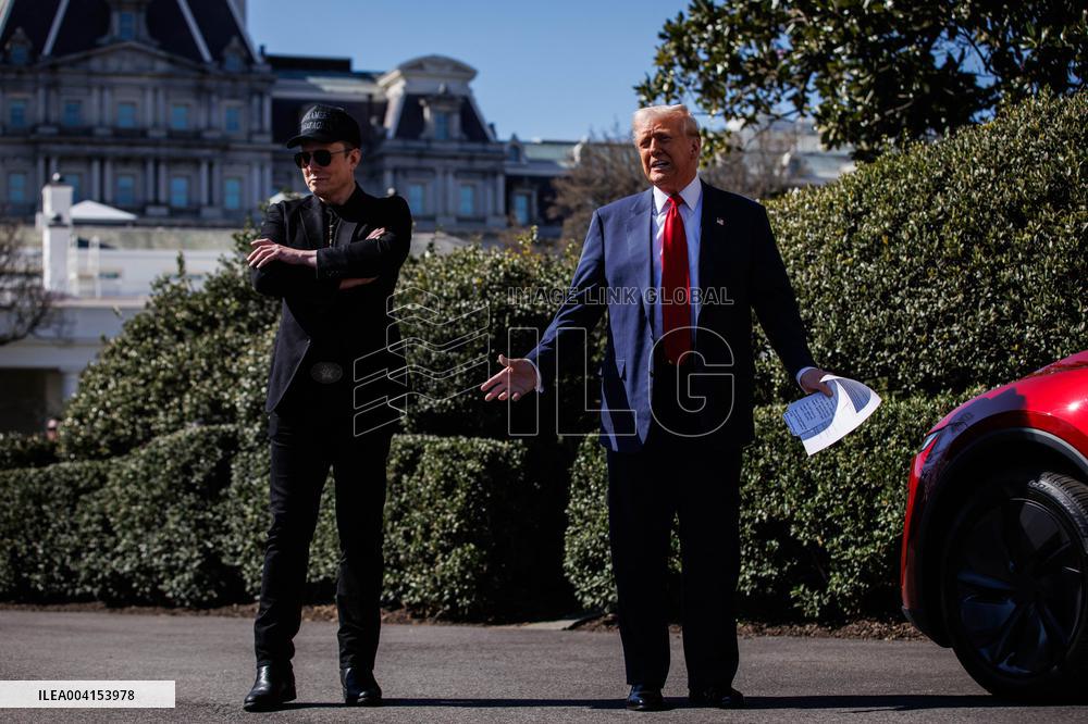 DC: President Trump views Tesla vehicles in Front of The White House