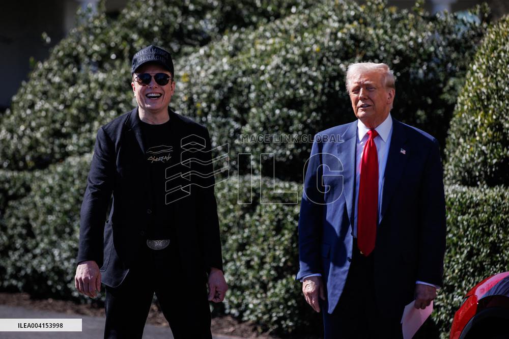 DC: President Trump views Tesla vehicles in Front of The White House
