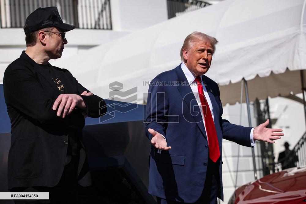 DC: President Trump views Tesla vehicles in Front of The White House