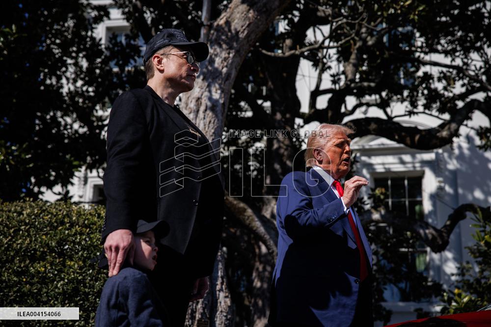 DC: President Trump views Tesla vehicles in Front of The White House