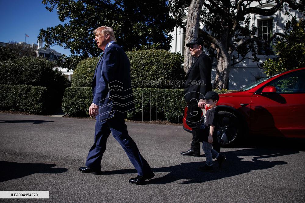 DC: President Trump views Tesla vehicles in Front of The White House