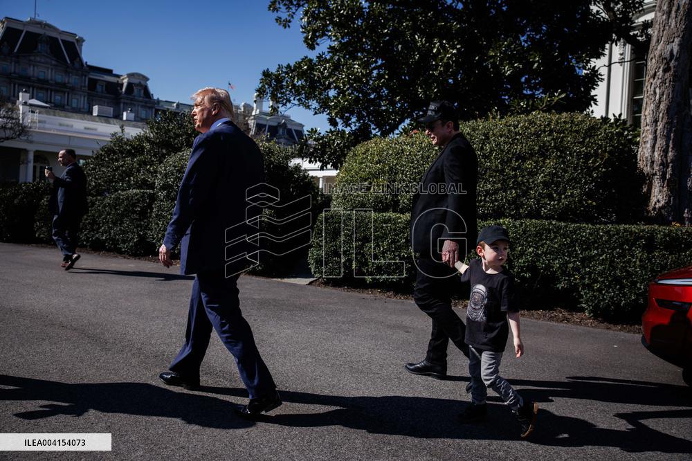 DC: President Trump views Tesla vehicles in Front of The White House