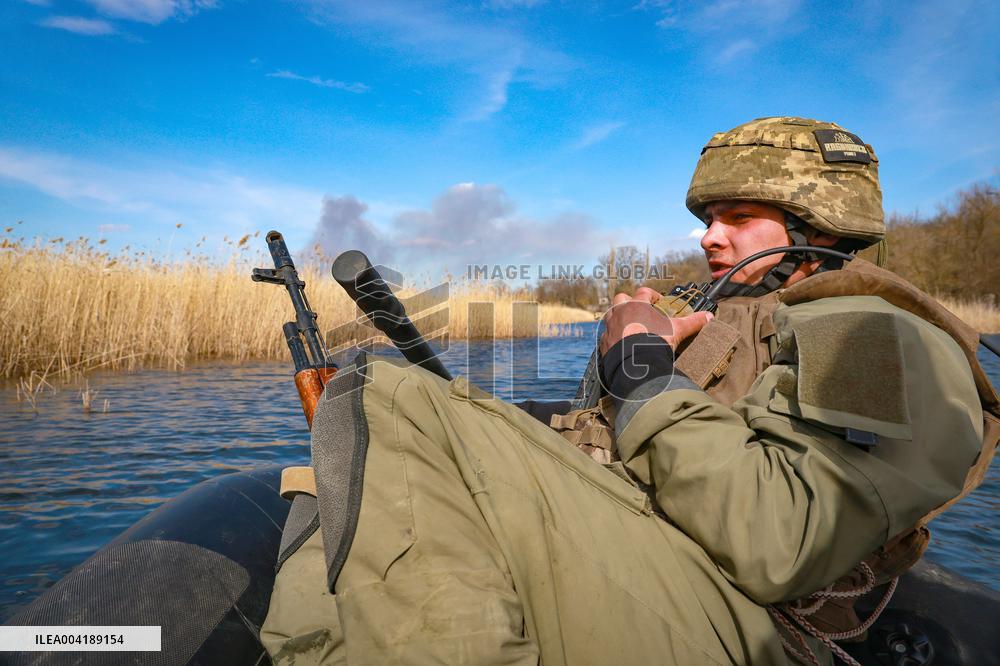 Soldiers of 40th Separate Coastal Defense Brigade practice landing from motorboats