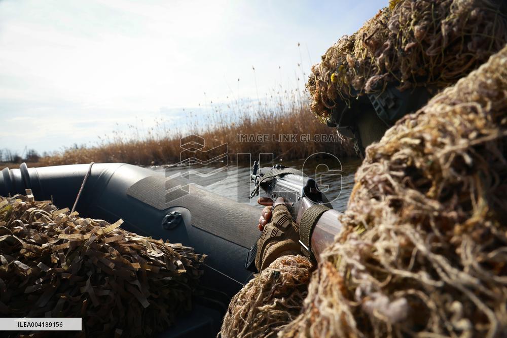 Soldiers of 40th Separate Coastal Defense Brigade practice landing from motorboats