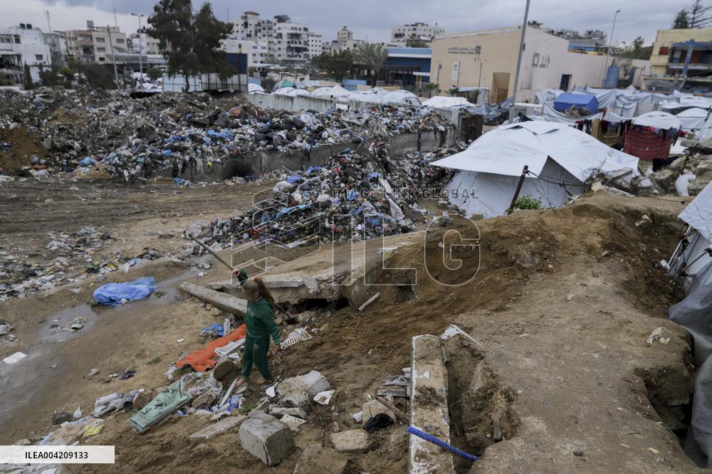 Displaced Palestinians live in partially demolished buildings - Gaza
