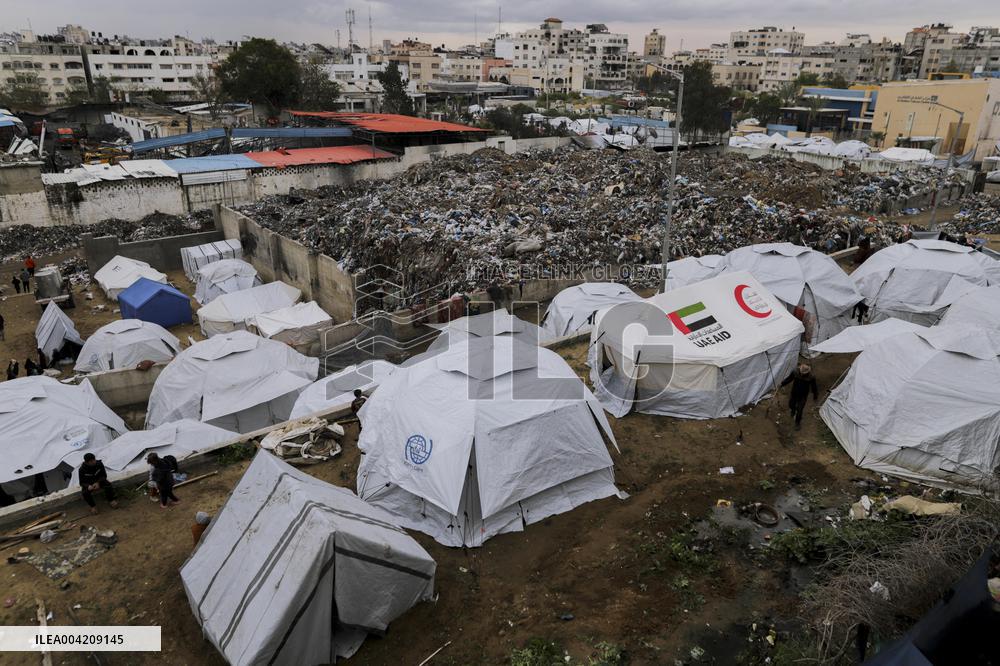 Displaced Palestinians live in partially demolished buildings - Gaza