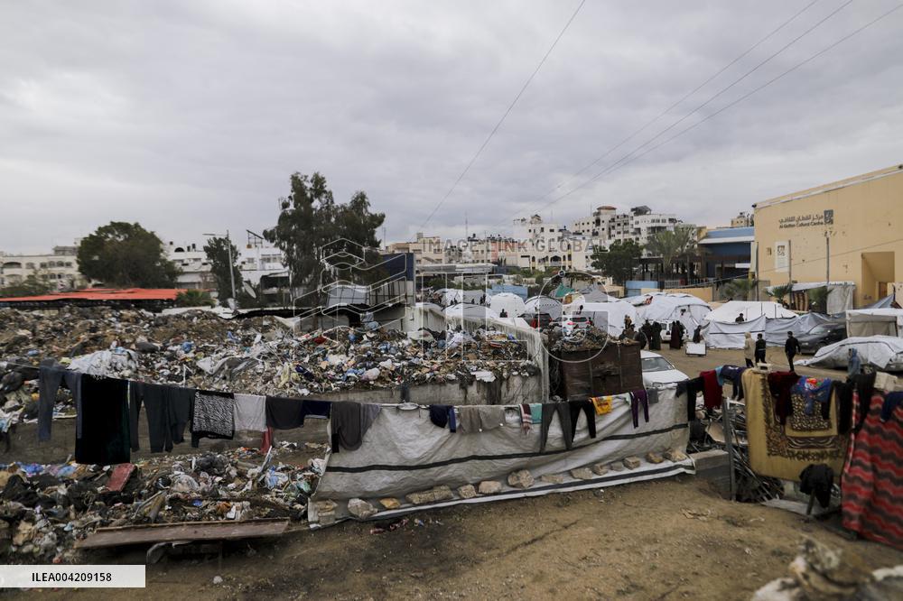 Displaced Palestinians live in partially demolished buildings - Gaza