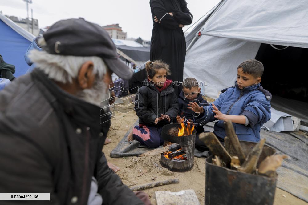 Displaced Palestinians live in partially demolished buildings - Gaza
