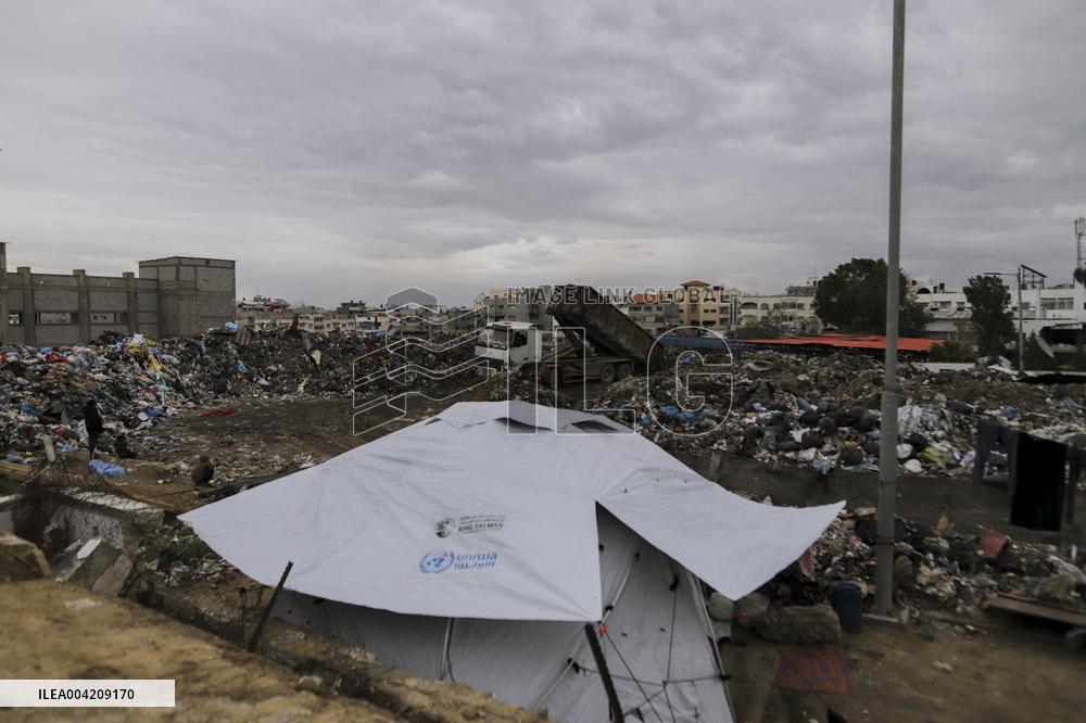 Displaced Palestinians live in partially demolished buildings - Gaza