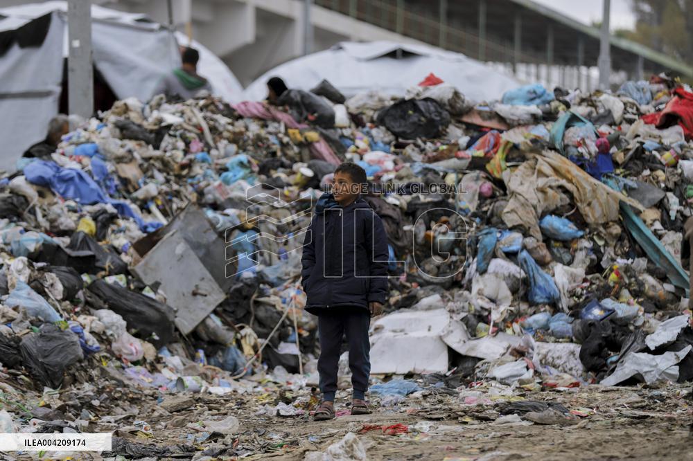 Displaced Palestinians live in partially demolished buildings - Gaza