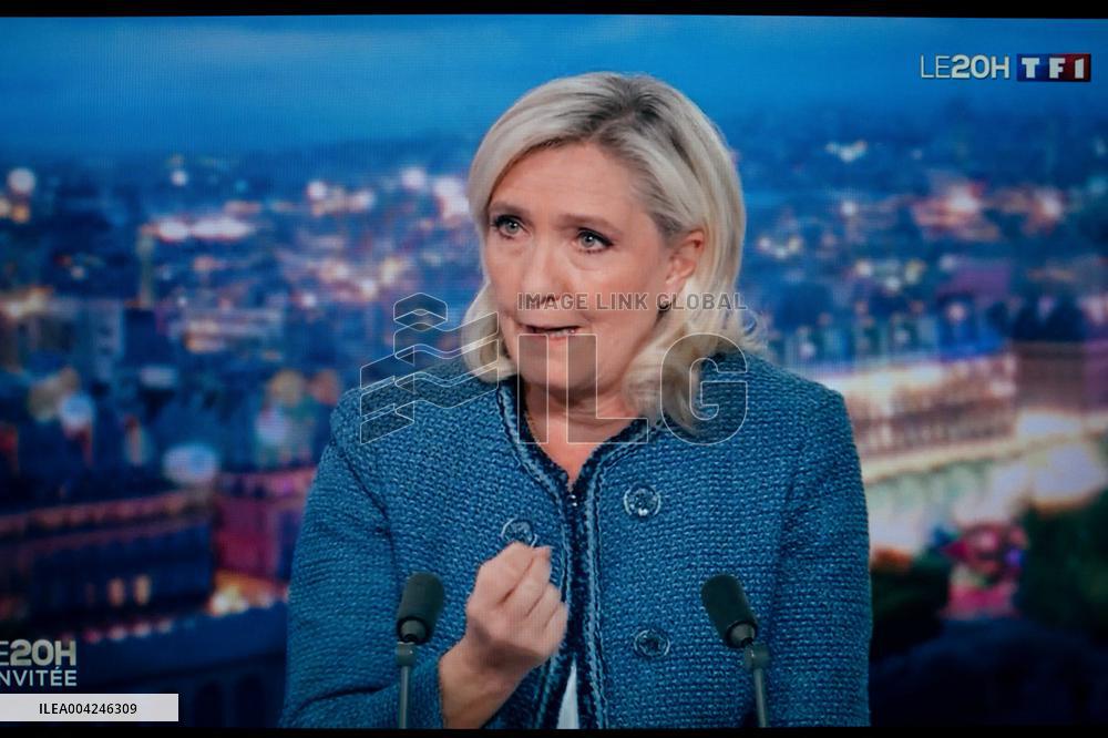 Marine Le Pen is seen on a monitor during a televised interview of TF1 - Paris AJ