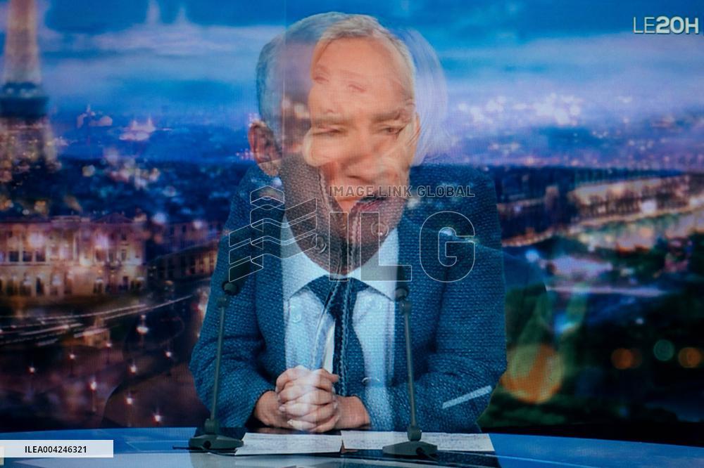 Marine Le Pen is seen on a monitor during a televised interview of TF1 - Paris AJ