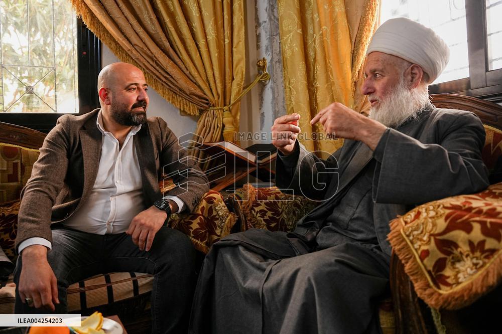 Members of the Syrian Sect visit people affected recently violence in Latakia - Syria