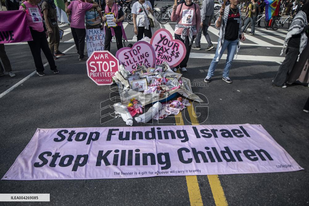 Pro-Palestinian protestors march from the National Gallery to ICE Headquarters in Washington, DC, on Saturday April 5, 2025. Thi