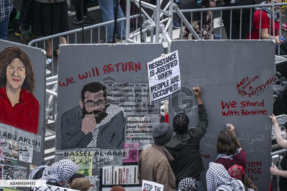 Pro-Palestinian protestors march from the National Gallery to ICE Headquarters in Washington, DC, on Saturday April 5, 2025. Thi