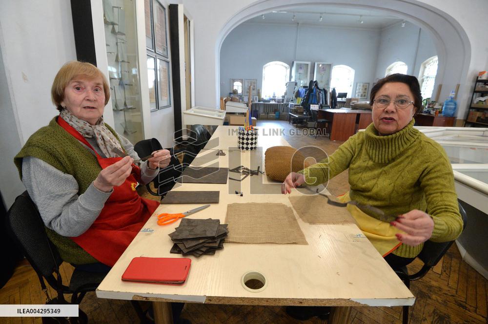 Weaving camouflage nets at Pecherski Kotyky volunteer center