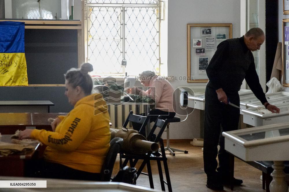 Weaving camouflage nets at Pecherski Kotyky volunteer center