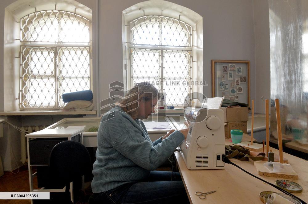 Weaving camouflage nets at Pecherski Kotyky volunteer center