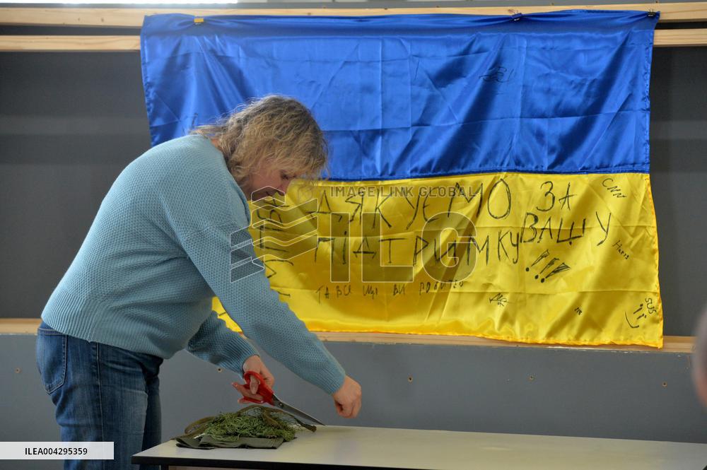 Weaving camouflage nets at Pecherski Kotyky volunteer center