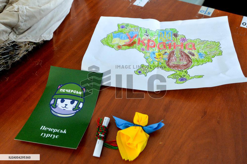 Weaving camouflage nets at Pecherski Kotyky volunteer center