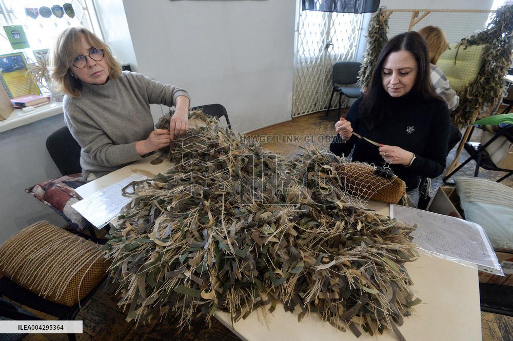 Weaving camouflage nets at Pecherski Kotyky volunteer center