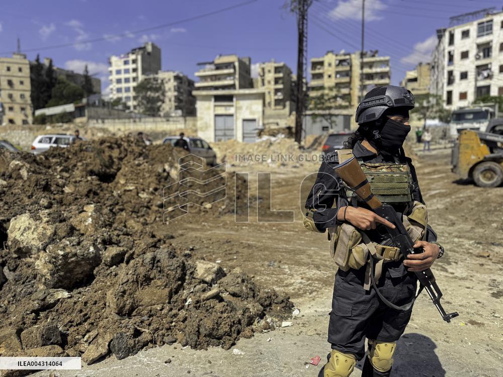 Bulldozer Clears Aleppo Road Under New Agreement