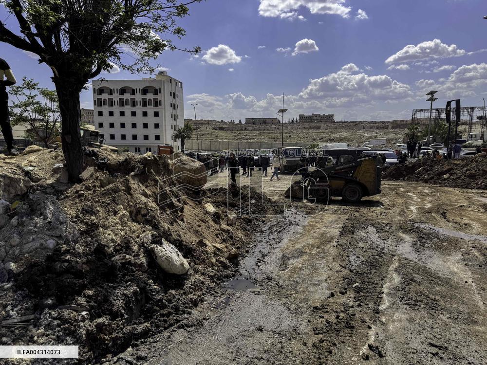 Bulldozer Clears Aleppo Road Under New Agreement