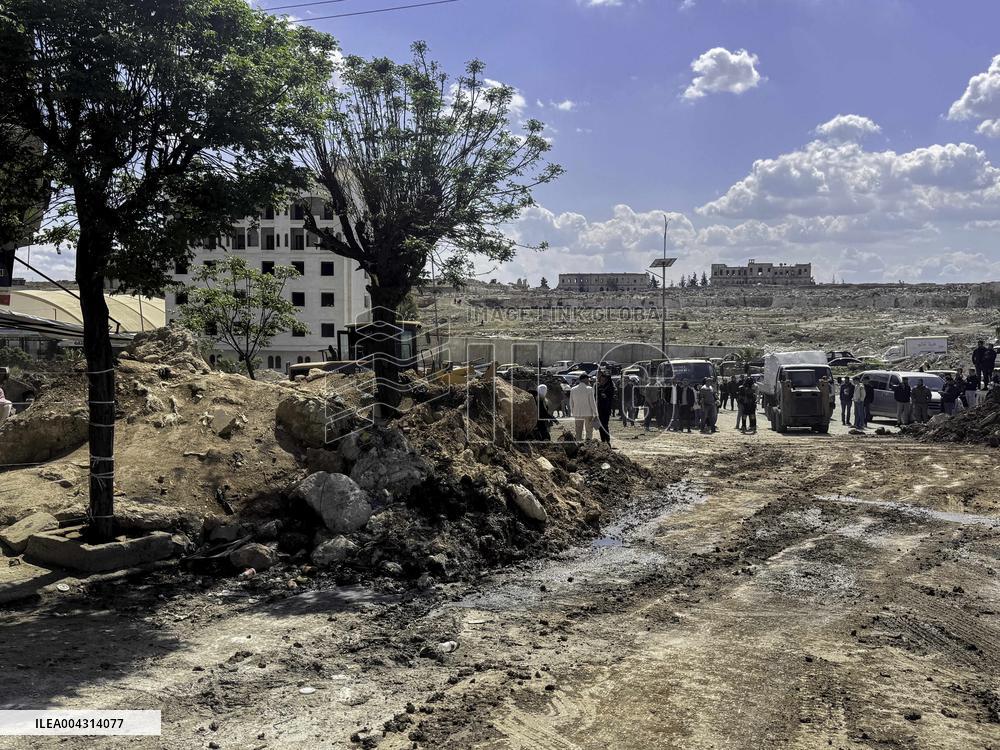 Bulldozer Clears Aleppo Road Under New Agreement