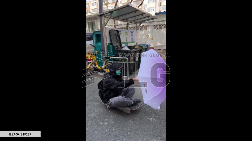 China: Boy in Beijing Effortlessly Glides on Skateboard Powered by Strong Winds