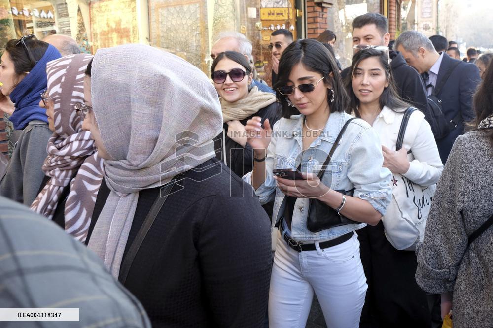 Iranian women defy the strict hijab laws in the street of Tehran