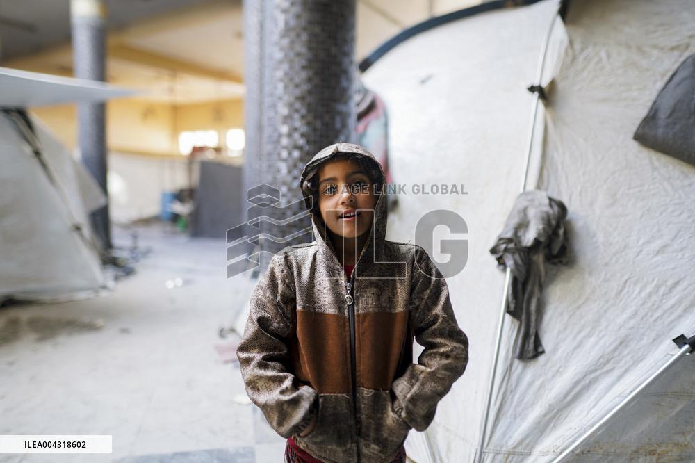 Displaced families live in the rubble of Islamic University - Gaza