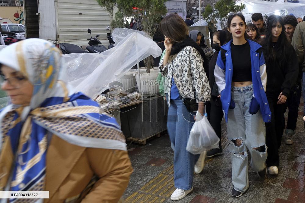 Iranian women defy the strict hijab laws in the street of Tehran