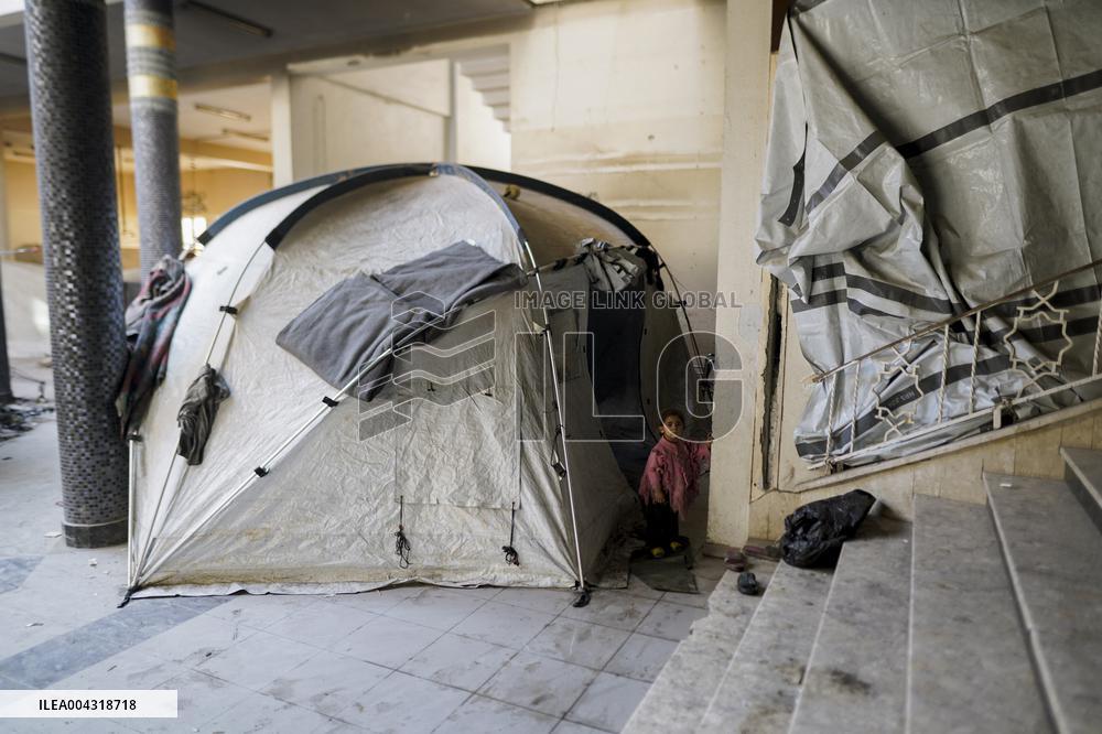 Displaced families live in the rubble of Islamic University - Gaza