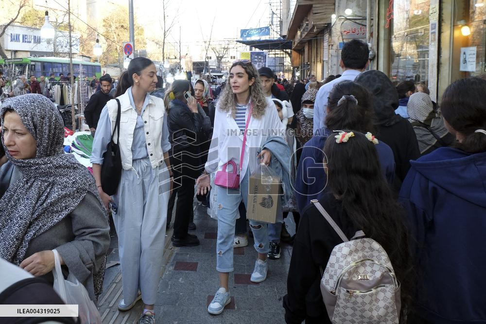Iranian women defy the strict hijab laws in the street of Tehran