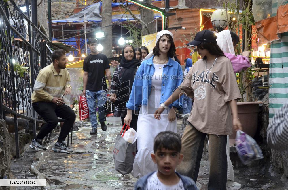 Iranian women defy the strict hijab laws in the street of Tehran