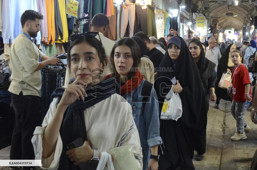 Iranian women defy the strict hijab laws in the street of Tehran