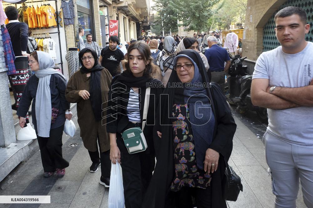 Iranian women defy the strict hijab laws in the street of Tehran
