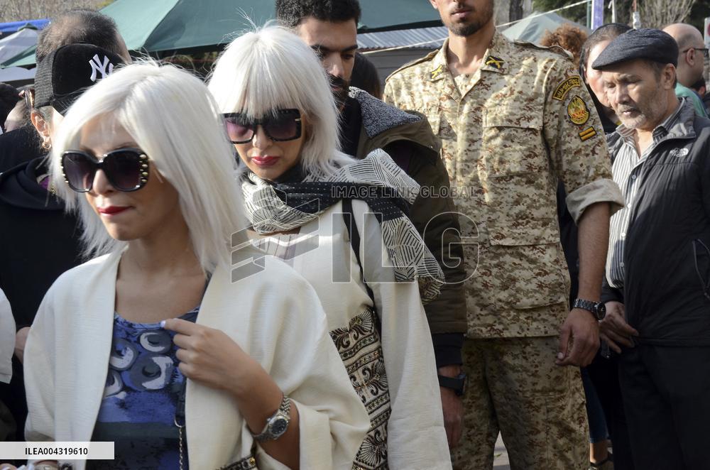 Iranian women defy the strict hijab laws in the street of Tehran
