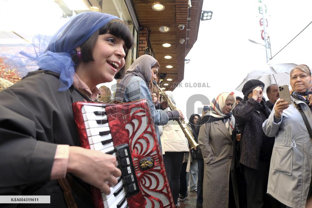 Iranian women defy the strict hijab laws in the street of Tehran