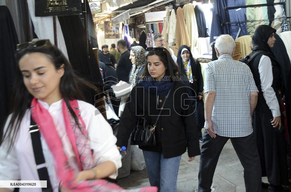 Iranian women defy the strict hijab laws in the street of Tehran