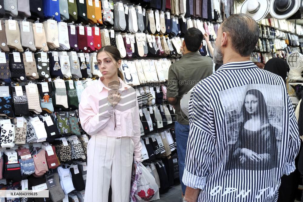 Iranian women defy the strict hijab laws in the street of Tehran