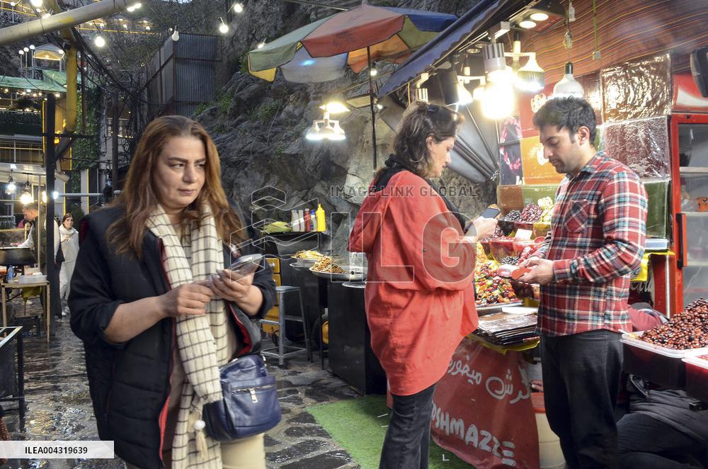 Iranian women defy the strict hijab laws in the street of Tehran